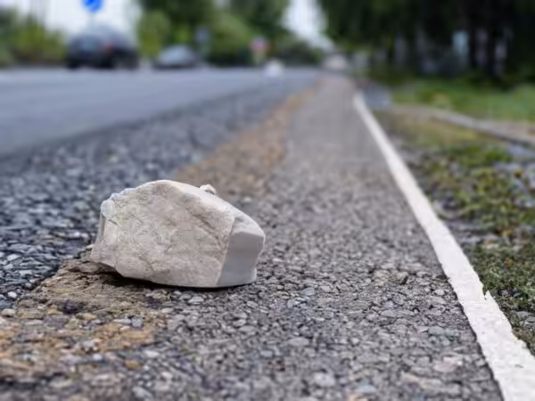 Rock on road shoulder